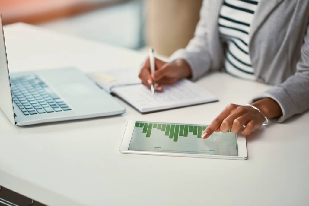 Person reviewing customer success analytics and KPIs