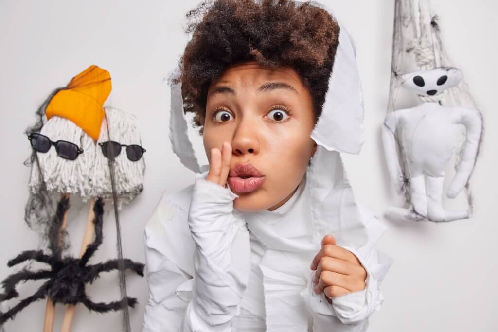 Person in costume with playful expression.