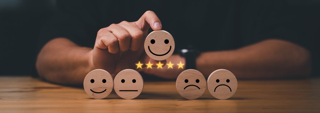 Smiley faces with five-star rating concept.